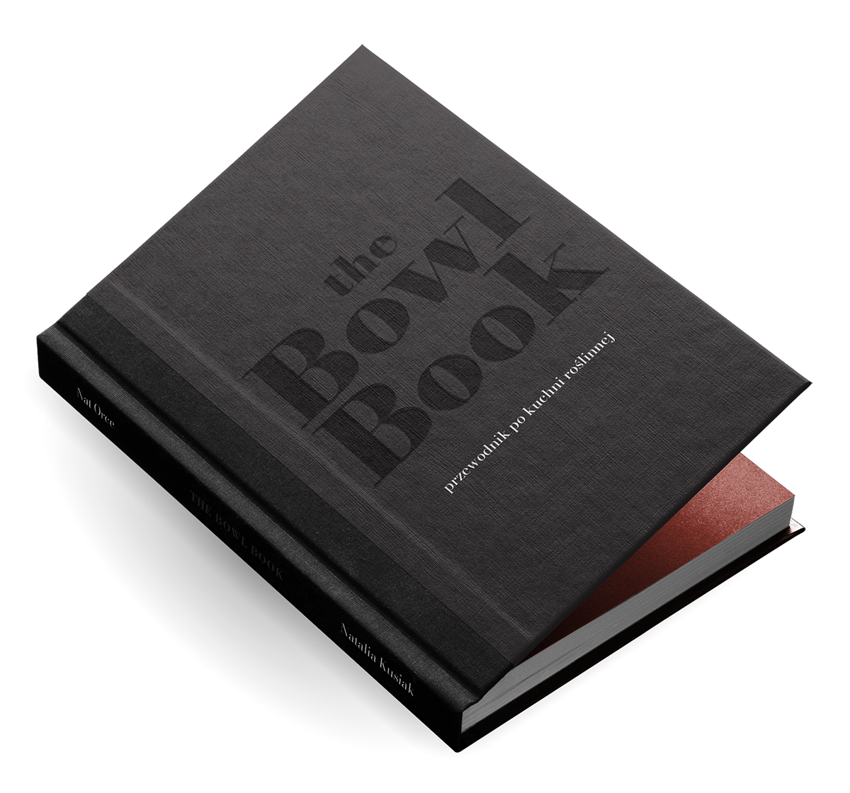 Okładka książki „The Bowl Book. Przewodnik po kuchni roślinnej” autorstwa Natalii Kusiak, w minimalistycznej, eleganckiej czarnej oprawie z czerwonymi brzegami kartek.